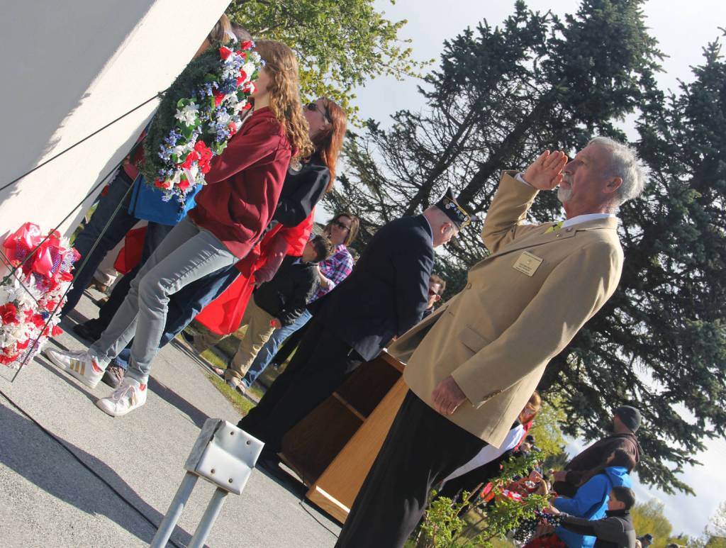 Kenai Elks V.P. Rick Mourek salutes the fallen.