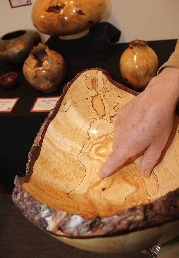 Wood turning artist Al Janonis shows his burl art at KVCC summer show.