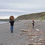 Derek Bynagle (left) and his son Johannes Bynagle of Homer carry marine debris they gathered back to a central camp on a small island near Augustine Volcano on Monday, June 5, 2017 on Augustine Island, Alaska. The Bynagles participated in a trip organized by the Center for Alaskan Coastal Studies to clean marine debris off the beaches of the remote island. (Photo by Elizabeth Earl/Peninsula Clarion)&nbsp;