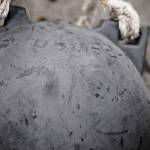 Madeline Lee, the summer Cook Inletkeeper intern, carries a bag of marine debris to a pile at the tideline to be picked up by a skiff on Sunday, June 4, 2017 on Augustine Island, Alaska. Lee participated in a trip with the Center for Alaskan Coastal Studies to the remote island to clean marine debris off the beaches. (Photo by Elizabeth Earl/Peninsula Clarion)