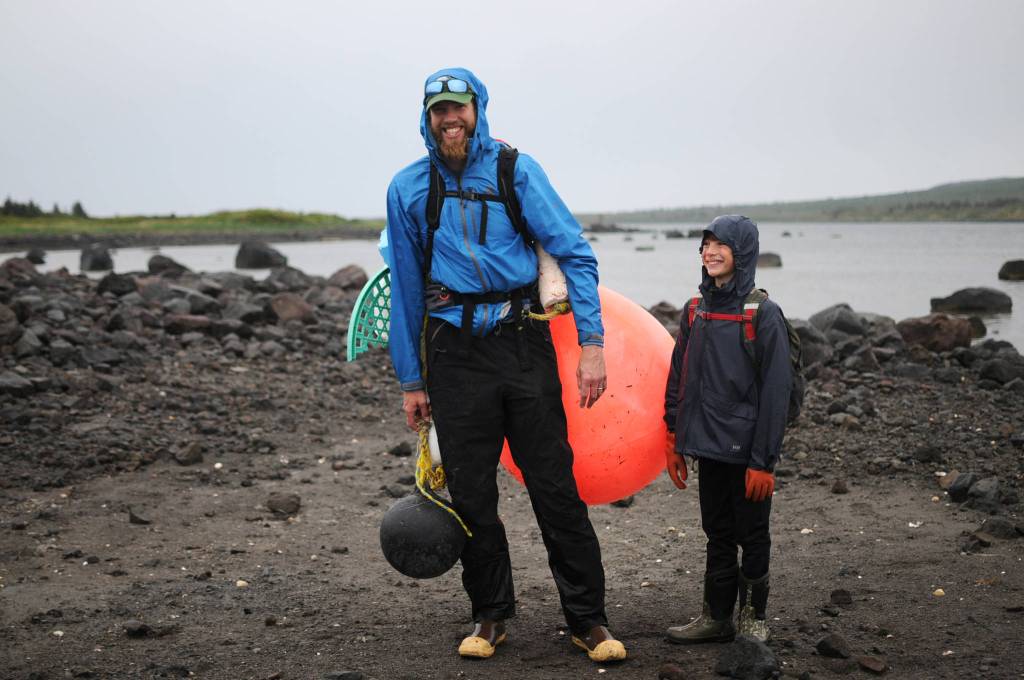 A buoy marked with Japanese characters sits in the sand on Sunday, June 4, 2017 on Augustine Island, Alaska. On the remote island’s eastern beach, trash lies entangled with the driftwood and clean volcanic sand. (Photo by Elizabeth Earl/Peninsula Clarion)