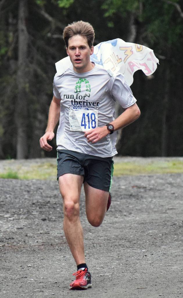 Men&rsquo;s Run for the River 5-kilometer winner Travis Mabe races to the finish line Saturday morning in Soldotna. (Photo by Joey Klecka/Peninsula Clarion)