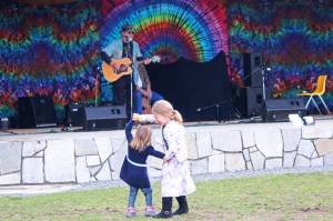 Graysen Besse, 5, gives Bensen Besse, 2, a twirl while dancing during this year&rsquo;s Kenai River Festival on Saturday, June 10, 2017 at Soldotna Creek Park in Soldotna, Alaska. (Megan Pacer/Peninsula Clarion)