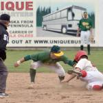 Oilers&rsquo; Kellen Strahm slides under the tag of Miners second baseman Brandon Chinea for a stolen base in the bottom of the third inning of Game 2 of the doubleheader Sunday, June 11, 2017, at Coral Seymour Memorial Park in Kenai. (Photo by Jeff Helminiak/Peninsula Clarion)
