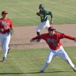 Oilers pitcher Devin Hayes throws to first to get Quin Cotton of the Miners and end a threat in the top of the fourth inning Monday, June 13, 2017, at Coral Seymour Memorial Park in Kenai. Caleb Hicks of the Oilers backs up the play while Oscar Marchena of the Miners runs to third. (Photo by Jeff Helminiak/Peninsula Clarion)