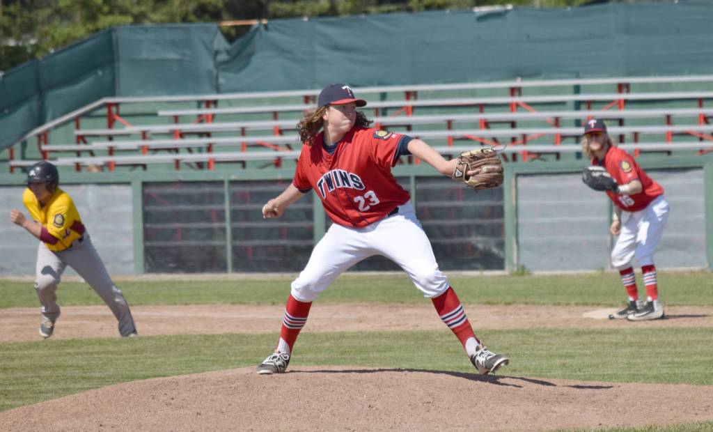 Twins starting pitcher Logan Smith delivers home in the first game of a doubleheader against Dimond on Saturday, June 17, 2017, at Coral Seymour Memorial Ballpark in Kenai. (Photo by Jeff Helminiak/Peninsula Clarion)