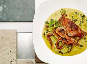 This June 11 photo provided by The Culinary Institute of America shows Sri Lankan crab curry in Hyde Park, N.Y. This dish is from a recipe by the CIA. (Phil Mansfield/The Culinary Institute of America via AP).