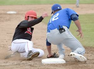 Oilers&rsquo; Caleb Hicks is tagged out by Glacier Pilots third baseman Sam Fragale in the first inning Thursday, June 22, 2017, at Coral Seymour Memorial Park in Kenai. (Photo by Jeff Helminiak/Peninsula Clarion)