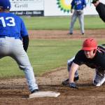 Peninsula Oilers baserunner Thomas Ruddy tags up to first base ahead of the glove of Ian Evans of the Anchorage Glacier Pilots, Friday evening at Coral Seymour Memorial Park in Kenai. (Photo by Joey Klecka/Peninsula Clarion)