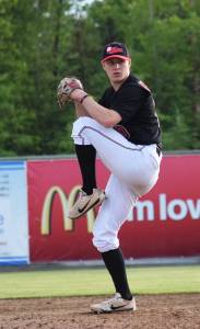 Peninsula Oilers pitcher Tyler Waldrop winds up for a throw against the Anchorage Glacier Pilots, Friday evening at Coral Seymour Memorial Park in Kenai. (Photo by Joey Klecka/Peninsula Clarion)