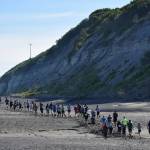 The field of 206 runners flood onto the beach Saturday at the third annual Clam Scramble Mud Run in Ninilchik. (Photo by Joey Klecka/Peninsula Clarion)