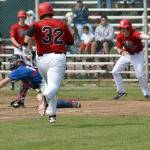 Glacier Pilots catcher Carter Bins prepares to collect the ball and swipe a successful tag on Jeremy Conant of the Oilers on Sunday, June 25, 2017, at Coral Seymour Memorial Park in Kenai. While Conant was out, Kellen Strahm (22) and Oliver Dunn had scored before him to provide the difference in a 2-1 victory. (Photo by Jeff Helminiak/Peninsula Clarion)