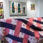 Ann-Lillion Schell is donating a pink and purple quilt to the Kenai Fine Art Center&rsquo;s Annual Harvest Auction, to be held September 30, 2017 in Kenai, Alaska. She also has work hanging in the center&rsquo;s monthly gallery installation, &ldquo;Arts Quilts Extra-Ordinaire,&rdquo; which will run until July 1. (Photo by Kat Sorensen/Peninsula Clarion)
