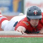 Kenai&rsquo;s Paul Steffensen dives back into first base during the second game of an Alaska American Legion Baseball doubleheader between Kenai Post 20 and Eagle River on Saturday, July 1, 2017 at the Loretta French Sports Complex in Chugiak. Eagle River won 11-6. (Photo by Matt Tunseth/Chugiak-Eagle River Star)