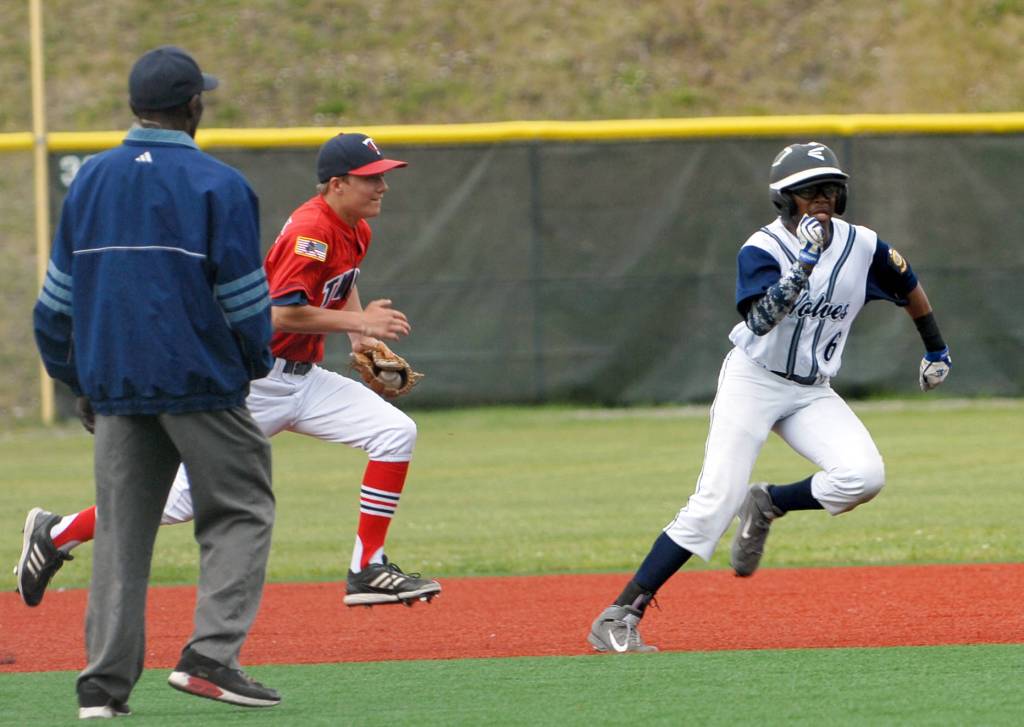 Kenai&rsquo;s Porter Fannon chases Eagle River&rsquo;s Kamren Williams back to second base during the second game of an Alaska American Legion Baseball doubleheader between Kenai Post 20 and Eagle River on Saturday, July 1, 2017 at the Loretta French Sports Complex in Chugiak. Eagle River won 11-6. (Photo by Matt Tunseth/Chugiak-Eagle River Star)