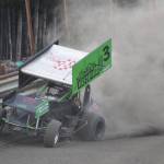 Sprint car driver Geoff Clark smacks the outside barrier during the Sprint feature event Saturday night at Twin City Raceway in Kenai. (Photo by Joey Klecka/Peninsula Clarion)