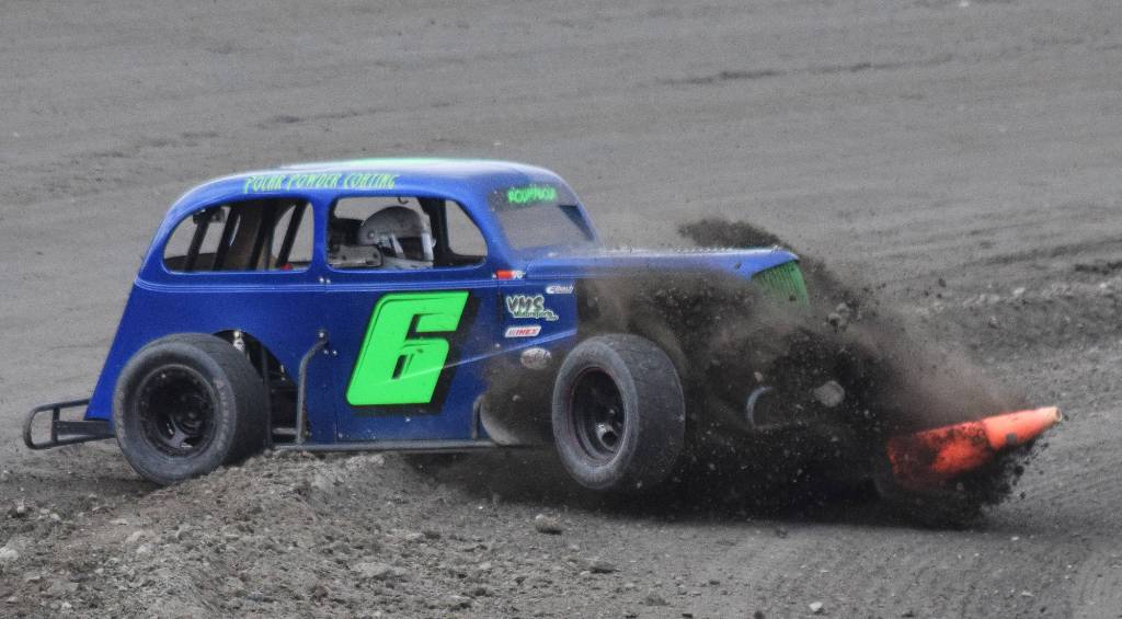 Legends driver Brent Ramagoux spins out and hops a dirt embankment during the Legends feature event Saturday night at Twin City Raceway in Kenai. (Photo by Joey Klecka/Peninsula Clarion)