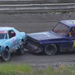 Butch Savely (78) gives Jeremy Euchuck a bump in the 50-lap &ldquo;Filthy Fifty&rdquo; feature event Saturday night at Twin City Raceway in Kenai. (Photo by Joey Klecka/Peninsula Clarion)