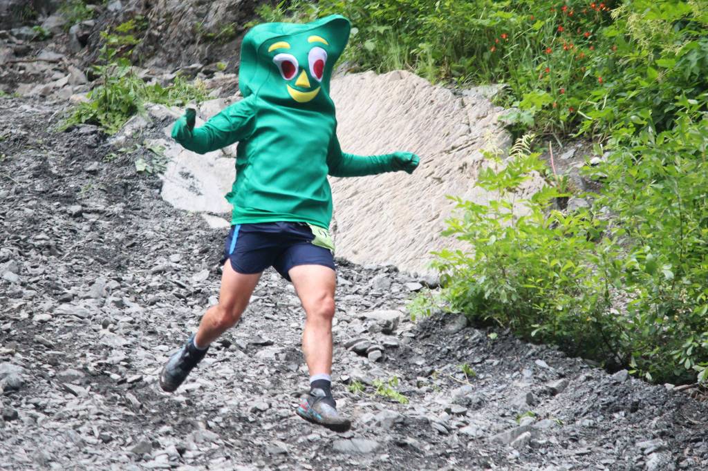 Seward&rsquo;s Joseph Nyholm runs down the base of Mount Marathon dressed a Gumby, his signature outfit each year, during the mountain race Tuesday, July 4, 2017 in Seward, Alaska. (Photo by Megan Pacer/Peninsula Clarion)