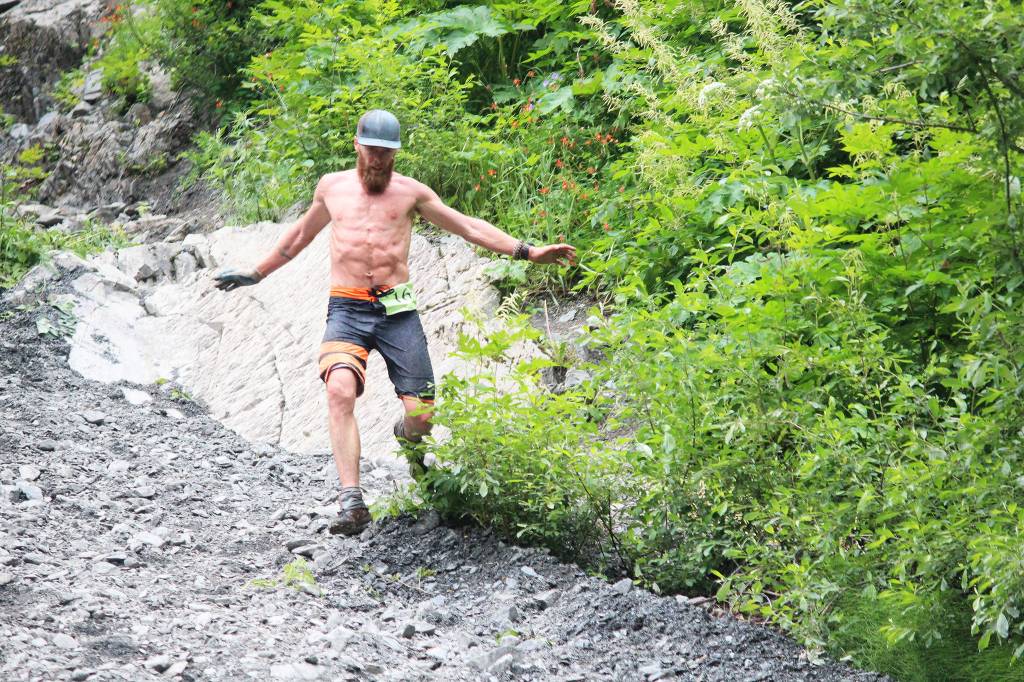 Seward&rsquo;s Erik Johnson runs down the base of Mount Marathon to claim second place in the Mount Marathon Race on Tuesday, July 4, 2017 in Seward, Alaska. (Photo by Megan Pacer/Peninsula Clarion)