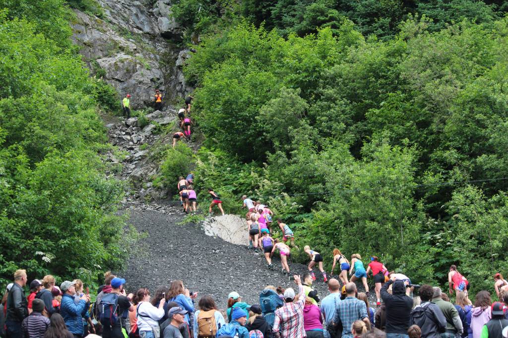Women participating in this year&rsquo;s Mount Marathon Race begin their ascent up the mountain&rsquo;s base in front of a crowd of spectators Tuesday, July 4, 2017 in Seward, Alaska. Soldotna&rsquo;s Allie Ostrander won the woman&rsquo;s race this year, beating her own personal best time. (Photo by Megan Pacer/Peninsula Clarion)