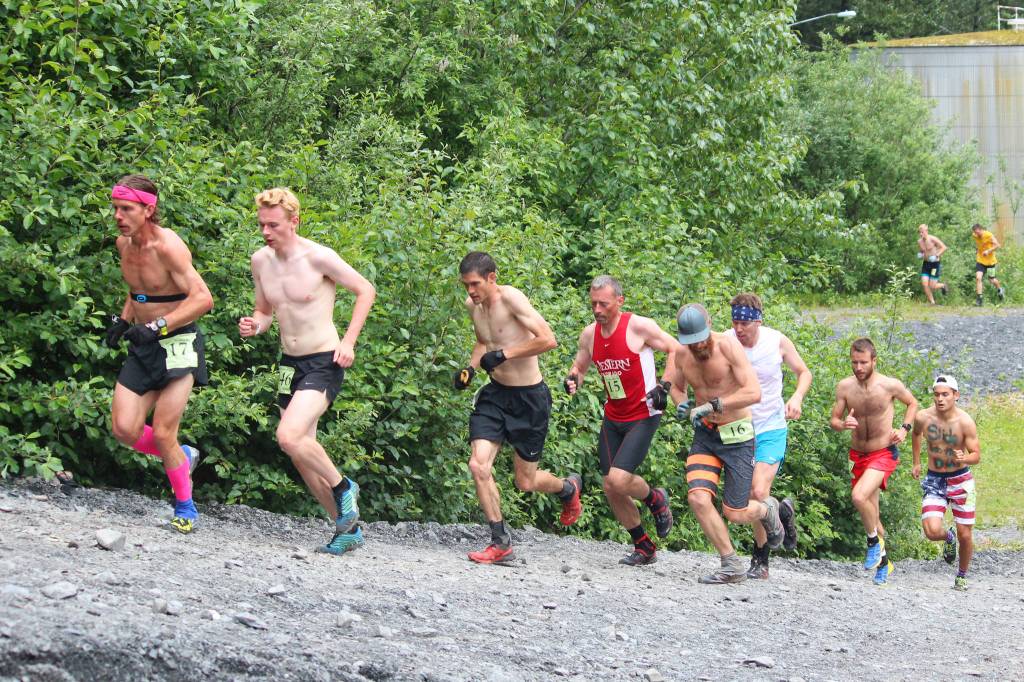 Men participating in this year&rsquo;s Mount Marathon Race start their ascent up the mountain&rsquo;s base in front of a cheering crowd Tuesday, July 4, 2017 in Seward, Alaska. (Photo by Megan Pacer/Peninsula Clarion)