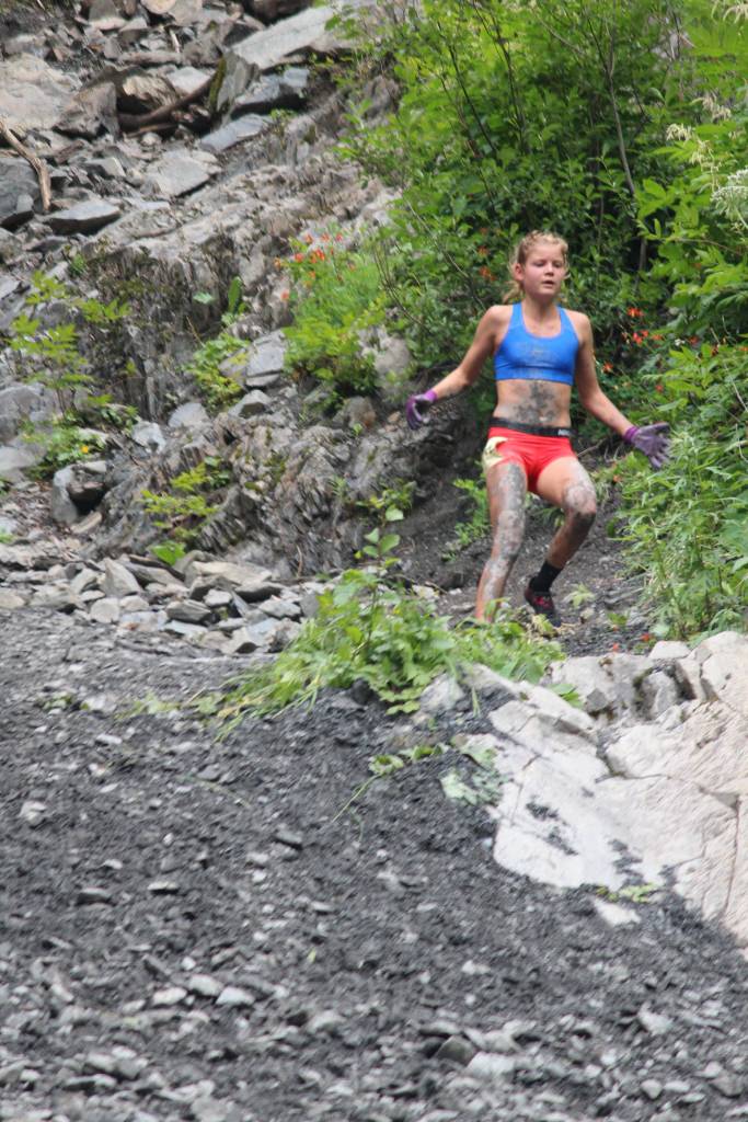 Soldotna native Allie Ostrander runs down the base of Mount Marathon minutes before taking first place in the annual mountain race Tuesday, July 4, 2017 in Seward, Alaska. At 20 years old, Ostrander beat her own previous record. (Photo by Megan Pacer/Peninsula Clarion)