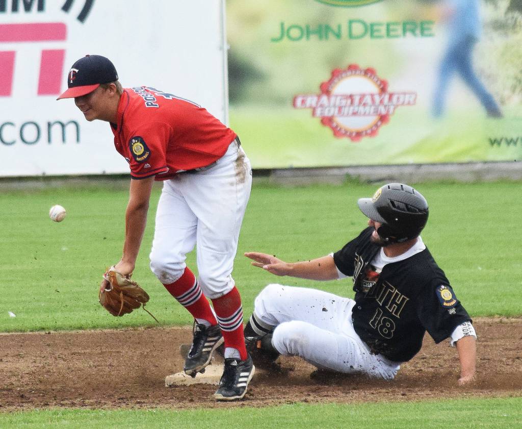 South&rsquo;s Derek McGinnis slides into second base ahead of the tage by Porter Fannon, Saturday at Coral Seymour Memorial Ballpark in Kenai. (Photo by Joey Klecka/Peninsula Clarion)