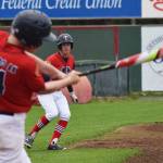 Post 20 Twins&rsquo; Jeremy Kupferschmid watches teammate Mose Hayes take a swing against South Post 4 Saturday at Coral Seymour Memorial Park in Kenai. (Photo by Joey Klecka/Peninsula Clarion)