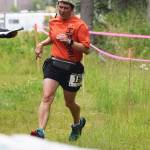 Kelly McDevitt approaches a water station during the five-mile race Saturday at the Rotary Unity Run at Tsalteshi Trails.
