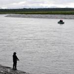 Anglers cast for sockeye salmon from the Kenai River bank at Cunningham Park on Wednesday, July 19, 2017 in Kenai, Alaska. After several days of heavy rain across the central Kenai Peninsula, the weather began to clear Wednesday, with the rain predicted to clear Thursday in exchange for clouds and some sunshine, transitioning to mixed clouds and sunshine and temperatures in the mid-60s, according to the National Weather Service. (Photo by Elizabeth Earl/Peninsula Clarion)