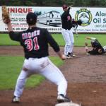 Peninsula Oilers second baseman Ryan Smith lobs a double play throw to first baseman Benjamin Wanger against the Anchorage Bucs Wednesday night at Coral Seymour Memorial Park in Kenai. (Photo by Joey Klecka/Peninsula Clarion) Peninsula Oilers second baseman Ryan Smith lobs a double play throw to first baseman Benjamin Wanger against the Anchorage Bucs Wednesday night at Coral Seymour Memorial Ballpark in Kenai. (Photo by Joey Klecka/Peninsula Clarion)
