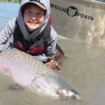 In this photo submitted to Fish for the Future, a young angler holds up the king salmon he caught and released. Fish for the Future, a program begun by two central Kenai Peninsula guides, offers prizes for people who submit photographs of king salmon they caught and released on the Kenai and Kasilof rivers in June and July as a way to encourage people to release fish and conserve the fishery over time. (Photo courtesy Fish for the Future)