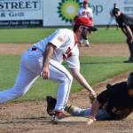 Peninsula Oilers first baseman Benjamin Wanger applies the tag to Anchorage Bucs baserunner Cole Kleszcz, Friday at Coral Seymour Memorial Ballpark in Kenai. (Photo by Joey Klecka/Peninsula Clarion)
