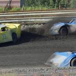Jason Magers (33) kicks up dirt onto the windshielf of a fellow Late Models racer as Al Ulman (74) drives by during the running of the Alaska Dirt Track Shootout held Saturday at Twin City Raceway in Kenai. (Photo by Joey Klecka/Peninsula Clarion)