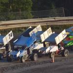 A field of 14 Sprint Cars line up in a traditional three-wide &ldquo;Salute to the Fans&rdquo; during the running of the Alaska Dirt Track Shootout held Saturday at Twin City Raceway in Kenai. (Photo by Joey Klecka/Peninsula Clarion)
