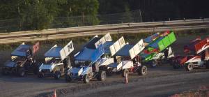 A field of 14 Sprint Cars line up in a traditional three-wide &ldquo;Salute to the Fans&rdquo; during the running of the Alaska Dirt Track Shootout held Saturday at Twin City Raceway in Kenai. (Photo by Joey Klecka/Peninsula Clarion)