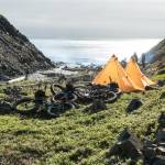 Alayne Tetor, right, holds a walrus skull she found on the beach on the way to Point Lay. Kim McNett is at left. (Photo courtesy Bj&