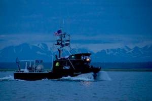 In this July 2016 photo, a commercial drift gillnet boat makes its way out of the Kenai River early in the morning in Kenai, Alaska. (Photo by Elizabeth Earl/Peninsula Clarion, file)