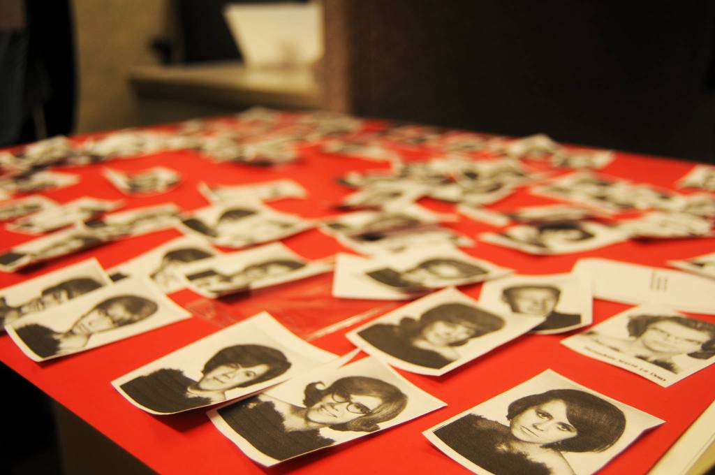 Kenai Central High School graduates&rsquo; yearbook photos lie spread out on a poster board at the 50th Kenai Central High School Class of 1967 reunion at the Kenai Senior Center on Friday, July 28, 2017 in Kenai, Alaska. The attendees wrote their names on nametags and taped a picture of themselves from high school to the tag. The reunion was organized to mark the &lsquo;67 graduating class&rsquo;s reunion, though classes from the &rsquo;60s, &rsquo;50s and the days of the Territorial School before that were also welcome. (Photo by Elizabeth Earl/Peninsula Clarion)