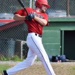 Thomas Ruddy swings at a Chugiak Chinooks pitch Saturday afternoon at Coral Seymour Memorial Ballpark in Kenai. (Photo by Joey Klecka/Peninsula Clarion)