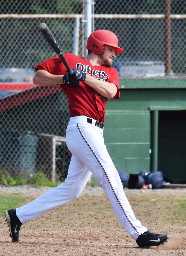 Thomas Ruddy swings at a Chugiak Chinooks pitch Saturday afternoon at Coral Seymour Memorial Ballpark in Kenai. (Photo by Joey Klecka/Peninsula Clarion)