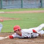 Peninsula Oilers baserunner Jack Bauer tags up to first base under the glove of Adam Rojas on Friday against the Chugiak Chinooks at Coral Seymour Memorial Park in Kenai. (Photo by Joey Klecka/Peninsula Clarion)