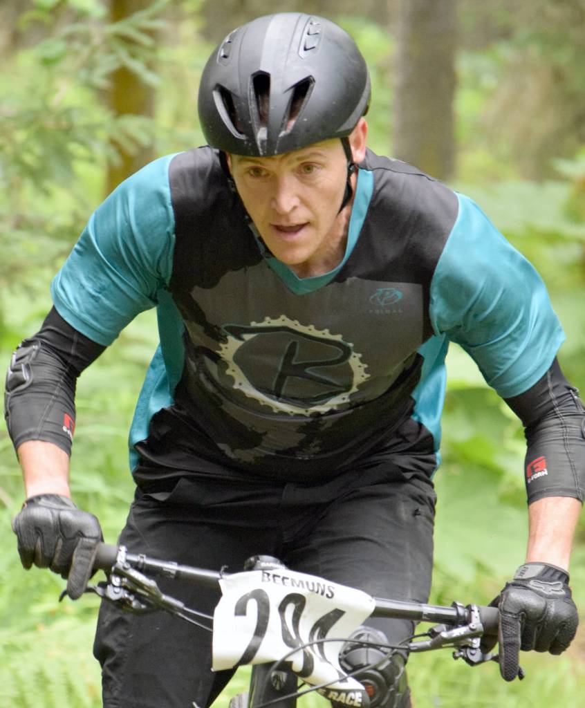 Mike Crawford picks out a line through the singletrack on the way to victory in Soldotna Cycle Series Race 6 on Thursday, Aug. 3, 2017, at Tsalteshi Trails in Soldotna. Crawford has won all six of the races this season. (Photo by Jeff Helminiak/Peninsula Clarion)