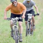 Matthew Dura leads Nathan Kincaid up the final climb in the 10-kilometer Soldotna Cycle Series Race 6, held Thursday, Aug. 3, 2017, at Tsalteshi Trails. Dura would finish fourth, while Kincaid would finish a second behind. (Photo by Jeff Helminiak/Peninsula Clarion)