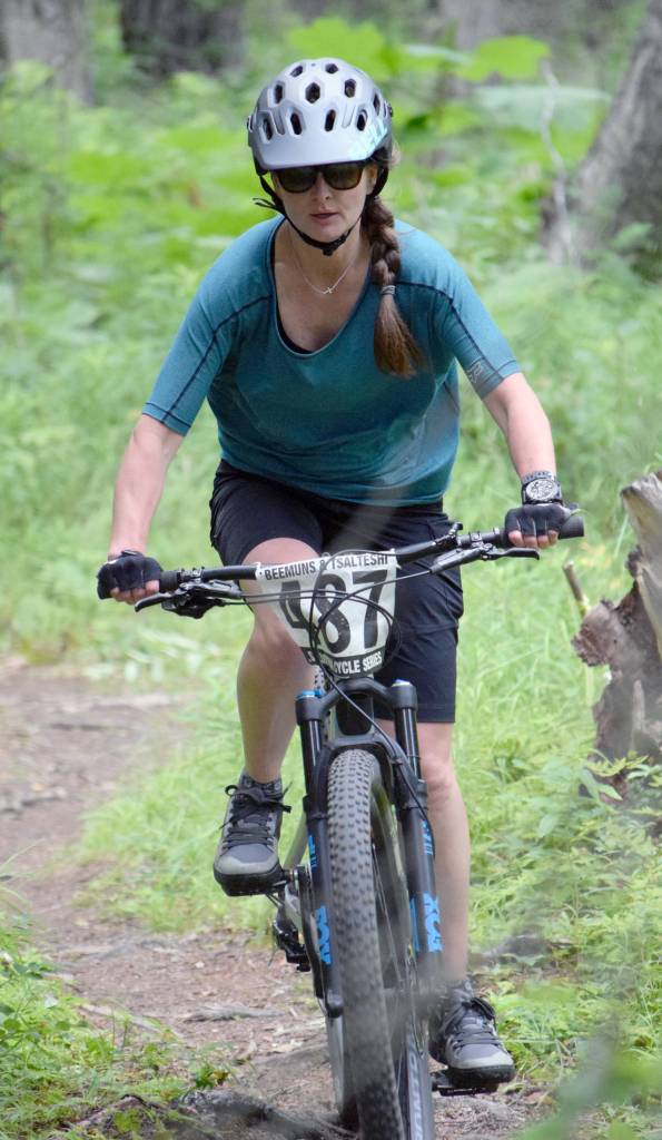 Jen Showalter bombs through the singletrack on the way to the top women&rsquo;s finish Thursday, Aug. 3, 2017, at Soldotna Cycle Series Race 6 at Tsalteshi Trails. (Photo by Jeff Helminiak/Peninsula Clarion)