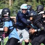 Varsity members of the Soldotna and Chugiak football teams clash Saturday in a preseason scrimmage at Justin Maile Field in Soldotna. (Photo by Joey Klecka/Peninsula Clarion)