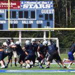Members of the Chugiak and Soldotna football teams scrimmage Saturday at Justin Maile Field in Soldotna. (Photo by Joey Klecka/Peninsula Clarion)