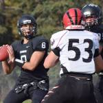 Photo by Joey Klecka/Peninsula Clarion Nikiski quarterback Ian Johnson (8) looks for a receiver in a Sept. 24, 2016, game against Eielson at Nikiski High School. (Photo by Joey Klecka/Peninsula Clarion)