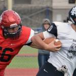 Kenai Central&rsquo;s Dawson Baker pursues Nikiski&rsquo;s Ian Johnson on Friday, July 11, 2017, during a scrimmage at Ed Hollier Field in Kenai. (Photo by Jeff Helminiak/Peninsula Clarion)